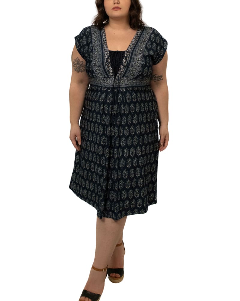 Front of a model wearing a size 1X Gisele Dress Bohemian Motif Front V Tie Black in Blue by ANNICK. | dia_product_style_image_id:290460